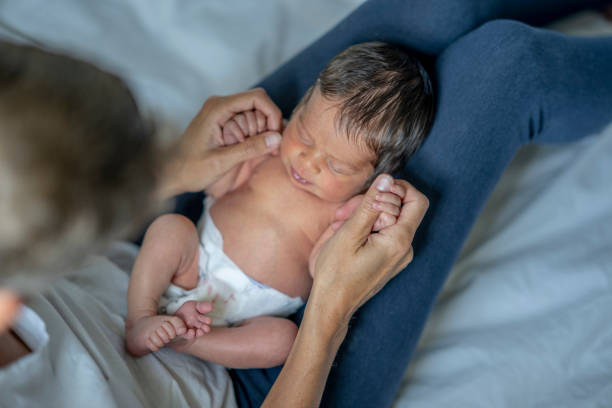 istock Newborn on a Mothers Lap 1421635180