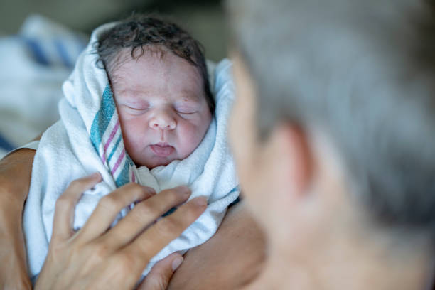 istock Mother With Her Newborn Baby 1421635479