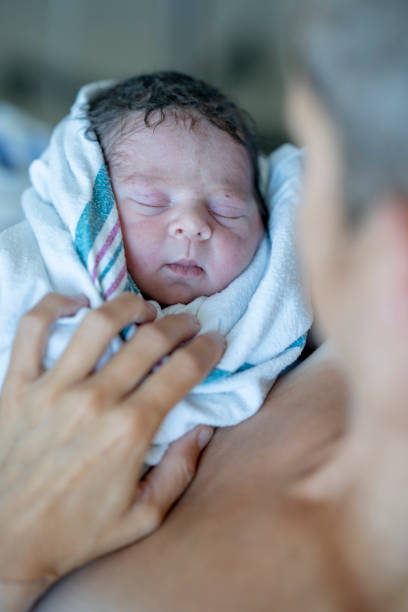 istock Mother With Her Newborn Baby 1421635484