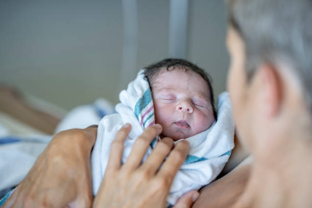 istock Mother With Her Newborn Baby 1421635872