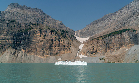 The Grinnell Glacier feeds icebergs into the adjacent lake and mountaink amphitheater