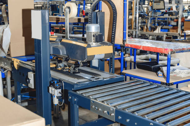 istock Cardboard packaging machine. Production line of packaging. Industry. 1421639381