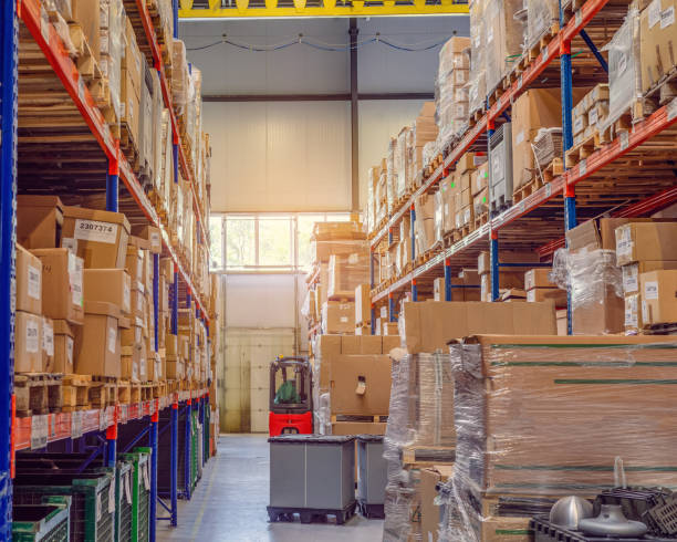 istock Background cardboard boxes inside the warehouse. Logistics center. The composition filled with cardboard boxes. 1421639456