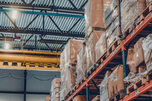istock Background cardboard boxes inside the warehouse. Logistics center. The composition filled with cardboard boxes. 1421639475