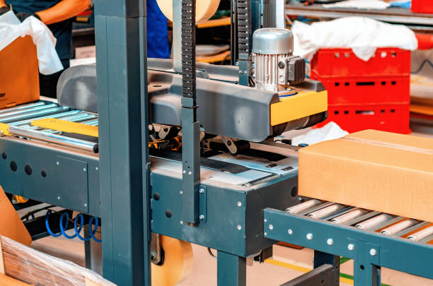istock Cardboard packaging machine. Production line of packaging. Industry. 1421641386