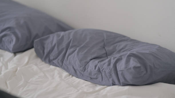 istock Man Waking up from Sleep in Bed 1421643253