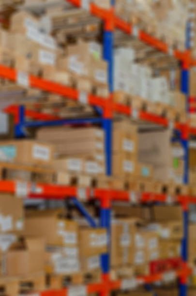 istock Industrial distribution, composition. Storage with high shelves, cargo boxes on racks. Rows of shelves with boxes at the factory. 1421644580