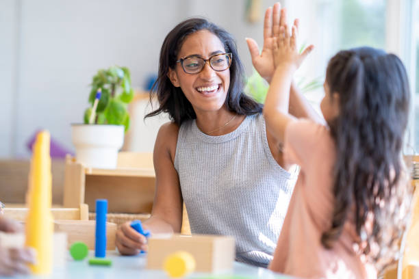 istock High Five in a Montessori Classroom 1421644857