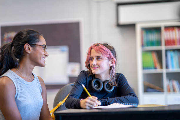 Tutor Working with a Female Student stock photo