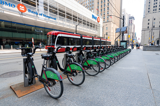 Toronto, Ontario, Canada - July 19 2021 : Bike Share Toronto bicycle-sharing system. King Street West streetcar station.