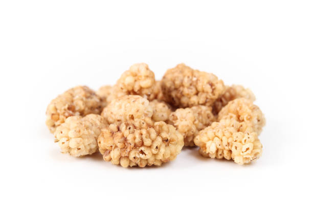 istock Dried mulberries in a pile, isolated. 1421646582