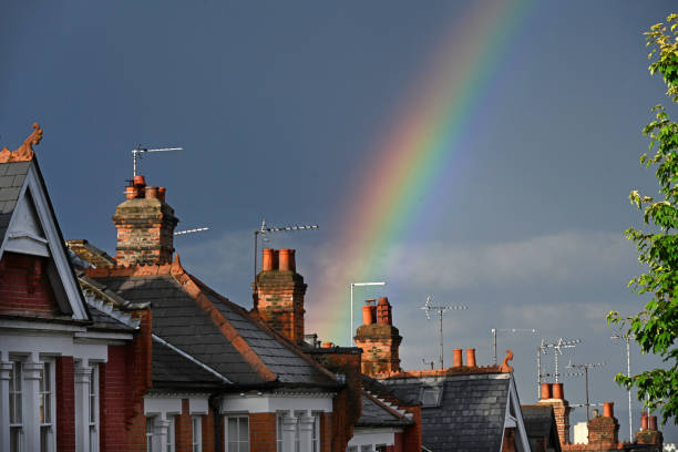 Suburban rooftop rainbow stock photo