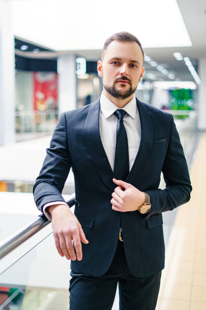 istock A young man with a beard dressed in a classic business suit. 1421648003