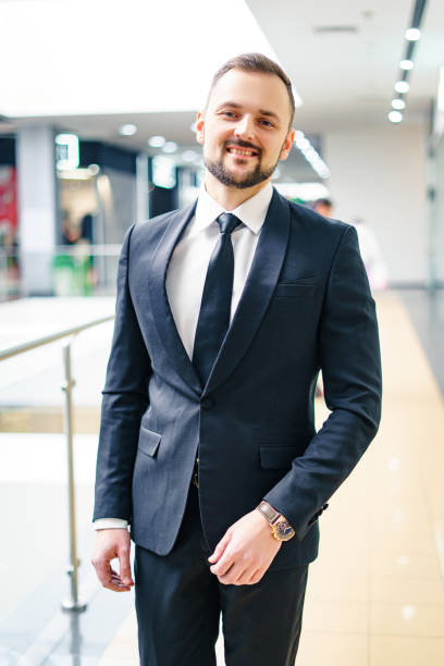 istock A young man with a beard dressed in a classic business suit. 1421648019
