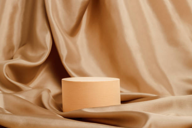 istock Geometric podium with golden silk smooth textile background 1421648835