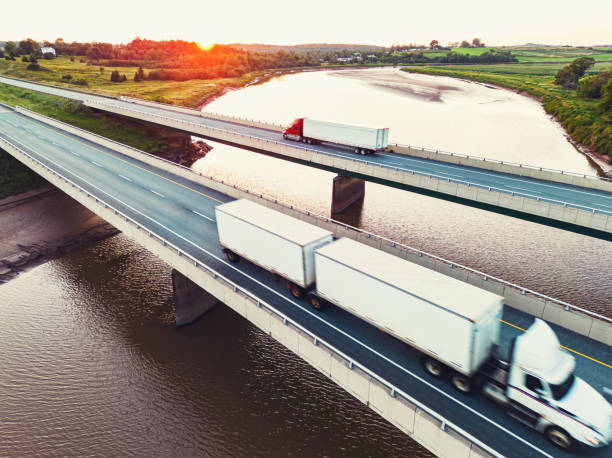 istock Semi Trucks Crossing River 1421653706