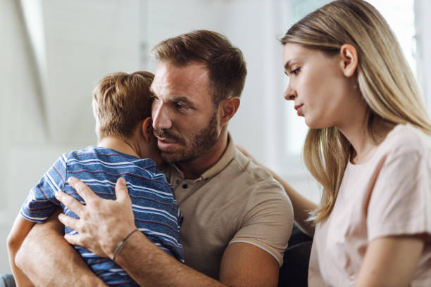 istock Parents  consoling their  small sad son at home 1421654139