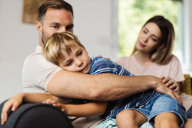 istock Parents  consoling their  small sad son at home 1421656067