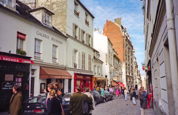 Paris, France - 1983: A vintage 1980's Fujifilm negative film scan of the cozy old streets of the quarter Montmartre in Paris, France.