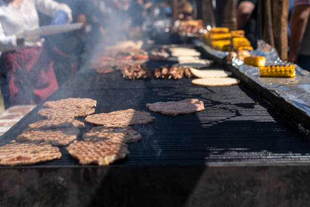 istock Cook grilling sausages 1421659230