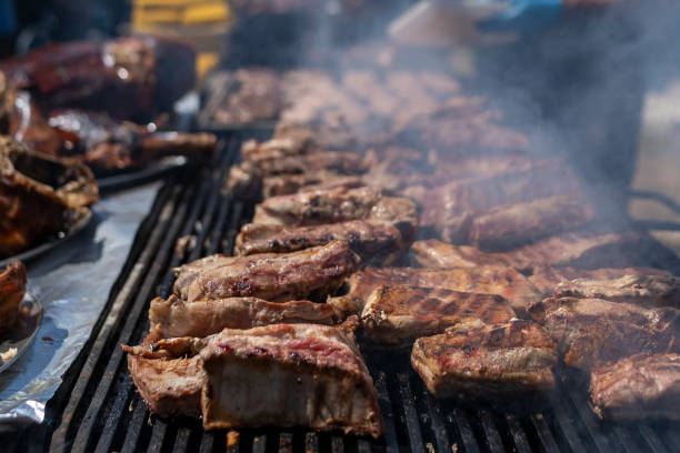 istock Cook grilling sausages 1421659252