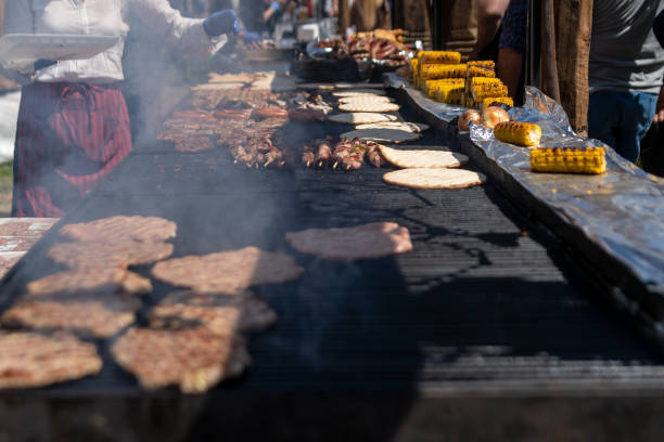 istock Cook grilling sausages 1421659253