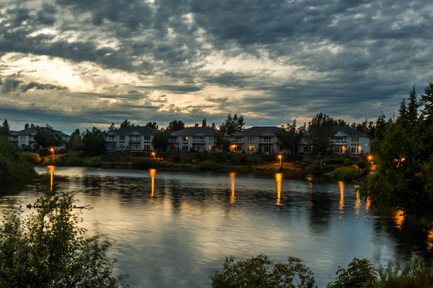 Modern cottages over lake shore in twilight in Keizer, Oregon