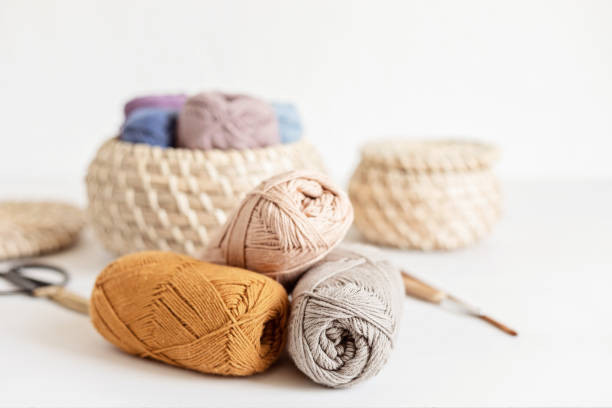 istock Craft hobby background with yarn in natural colors 1421660206