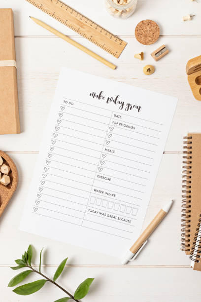 istock Desktop with planning template and office accessories. Organization, time managing, self-development concept. Top view, falt lay 1421660872