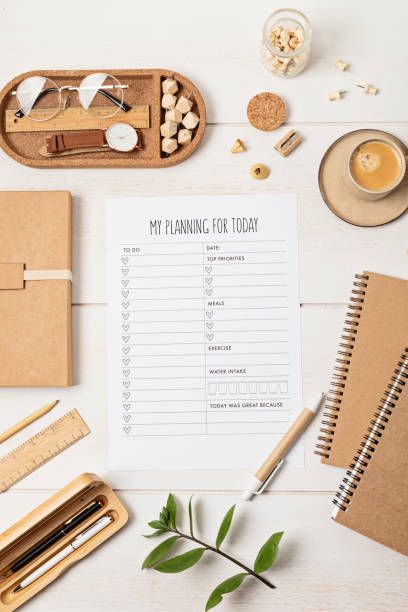 istock Desktop with planning template and office accessories. Organization, time managing, self-development concept. Top view, falt lay 1421660874