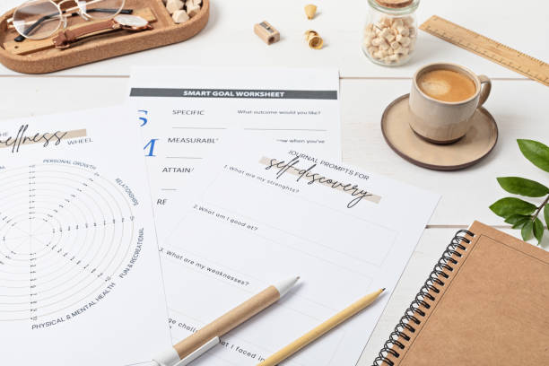 istock Desktop with life coaching templates and office accessories. Organization, self-development, online coaching concept. Top view, falt lay 1421660880