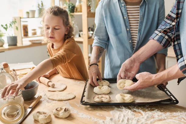 istock Family baking homemade buns 1421662409