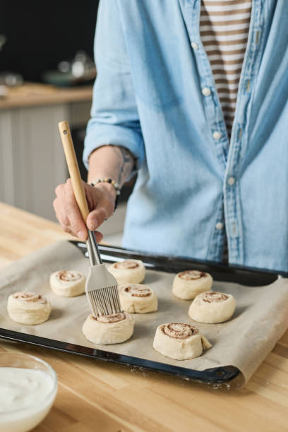 istock Woman making homemade buns with cinnamon 1421662589