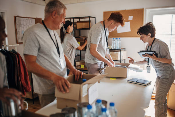 istock Volunteers working in charity center 1421665280