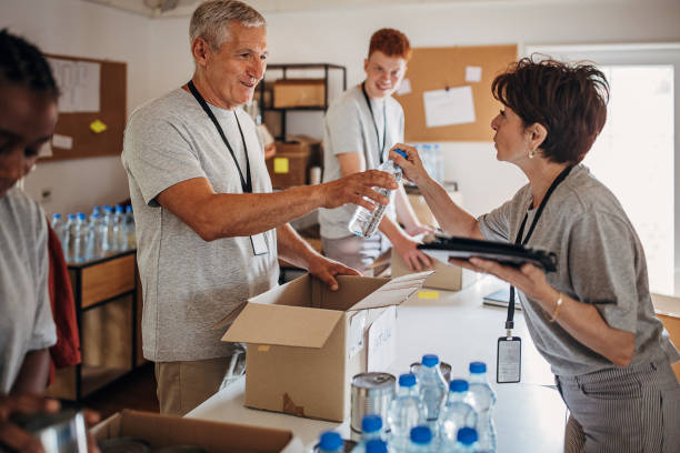 istock Volunteers working in charity center 1421665315