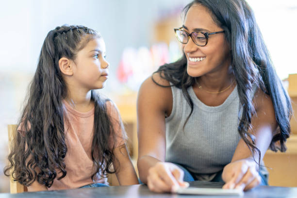 istock Montessori Teacher Working with a Student 1421666301