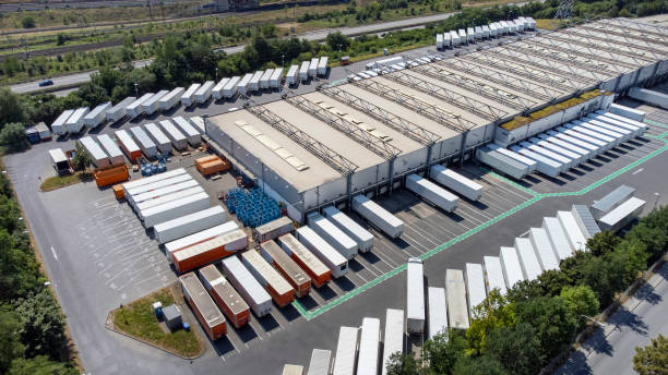 Distribution logistics building parking lot - aerial view stock photo
