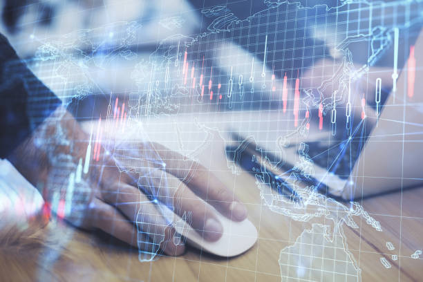 istock Close up of male hands using laptop keyboard with creative forex grid map on blurry background. Trade, finance, market and invest concept. Double exposure. 1421667216