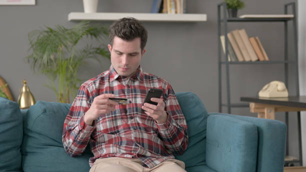 istock Man Unsuccessful Online Payment on Smartphone 1421668625