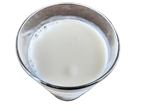 cow's milk in a glass isolated on white
