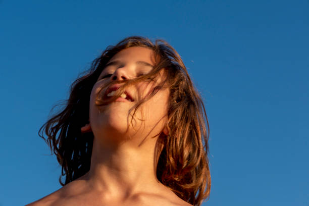 istock Boy having fun in sea 1421672127