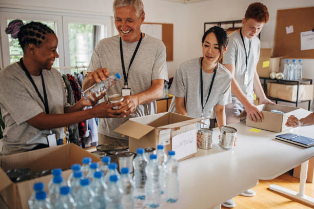 istock Volunteers working in charity center 1421672978