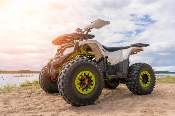 istock ATV on the sandy shore of the lake. front side view. 1421673019