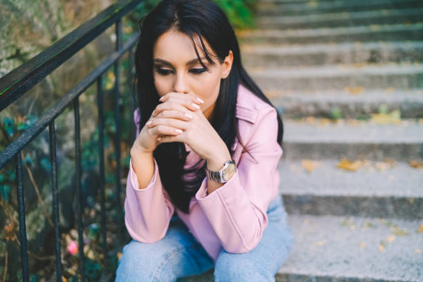 istock Depressed girl outside 1421675086