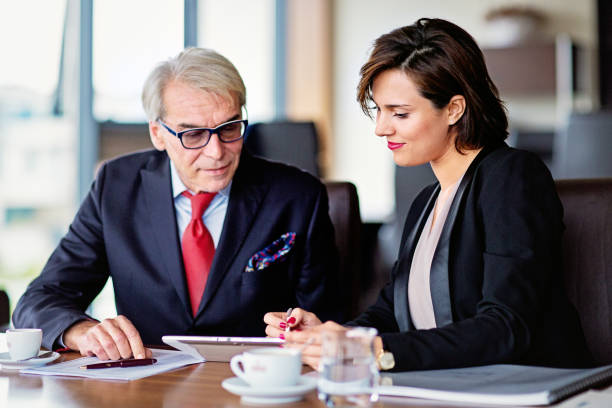 istock Business persons working in an office 1421679087