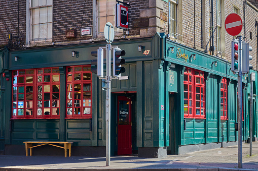 You find pubs all over the city, but Dudleys Pub is on the edge of the downtown pub district and more quiet area. To attract guests it it flashy green and red.