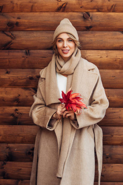 istock Beautiful woman holding leaves 1421682937