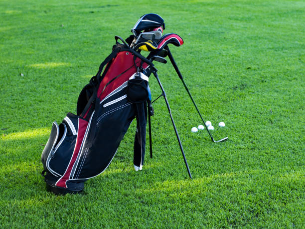 istock Golf bag loaded with golf clubs on a practice green. 1421683840