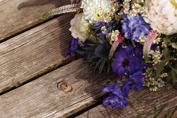 istock Wedding bouquet on wooden texture 1421686671