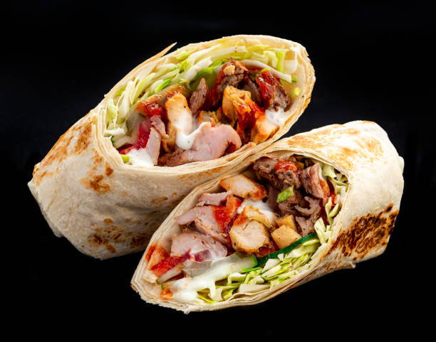 istock Beef shawarma on a dark background. Shawarma with beef in pita bread 1421688499